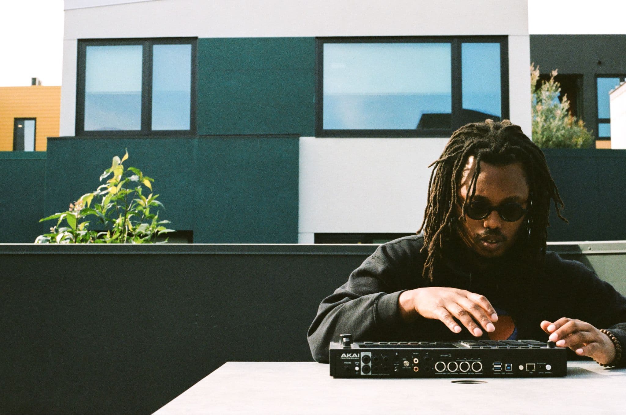 Christopher Norman working with music production equipment